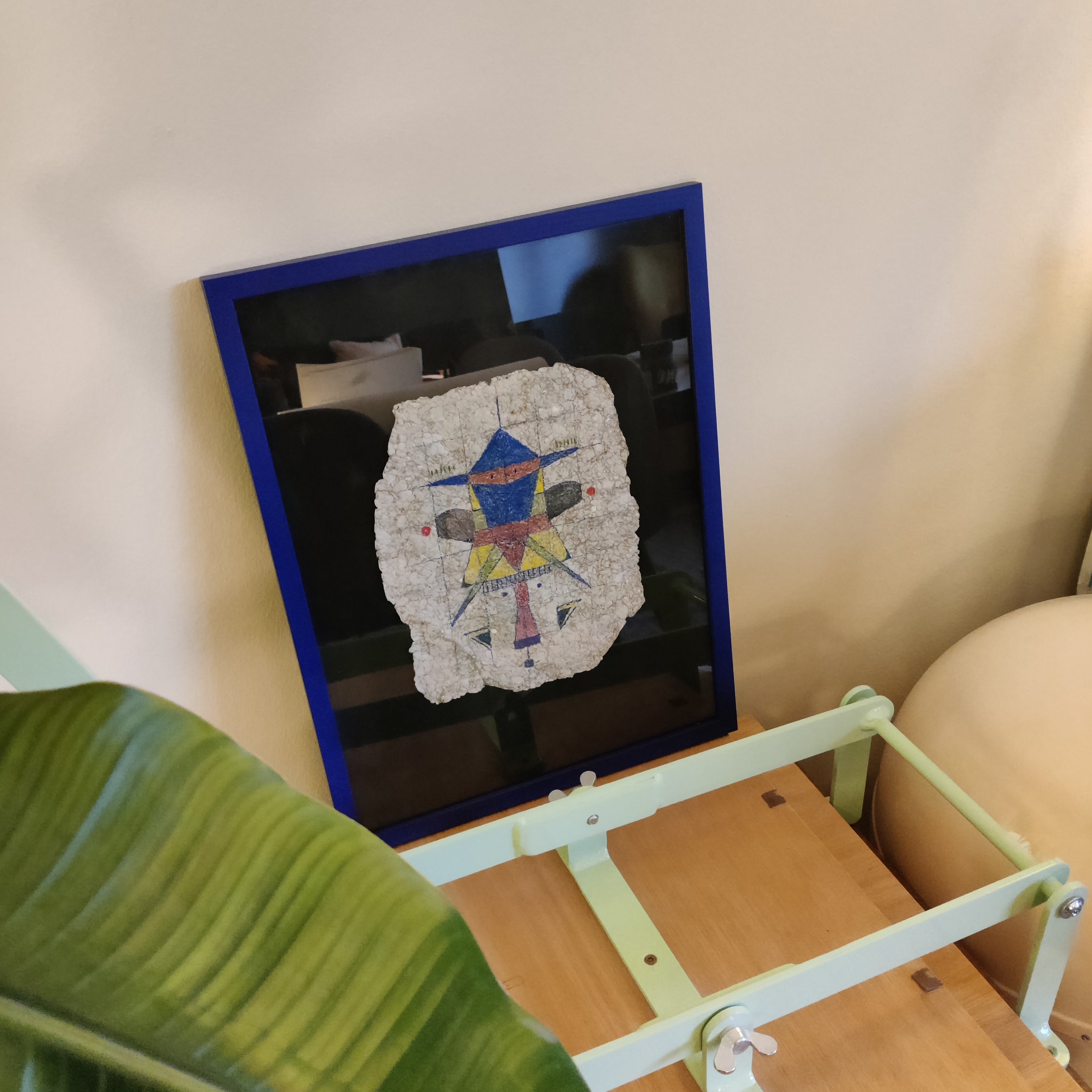 Paper Pulp Rocket Man, a framed sculptural work that builds on techniques related to layered paper and cardboard